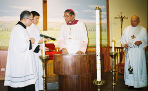 Bishop Perry begins the dedication of the altar.