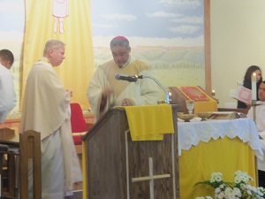 Bishop Perry begins the incensation of the altar, as a sign of honor to Christ.