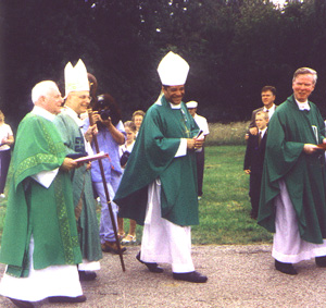 Deacon John Leonas, Cardinal George, Bishop Perry, and Father Gilligan